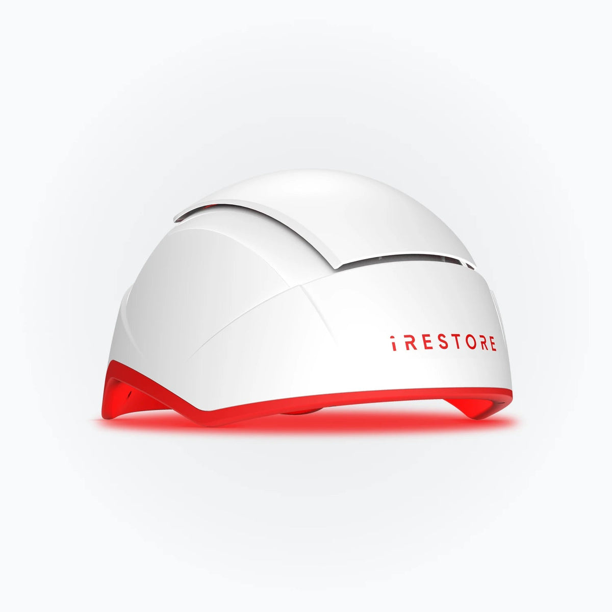 White iRESTORE Professional hair therapy helmet with red inner light, shown at an angle