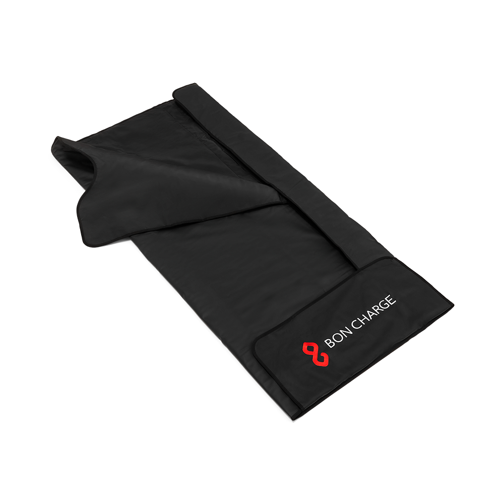 Black BON CHARGE infrared sauna blanket shown open at an angle