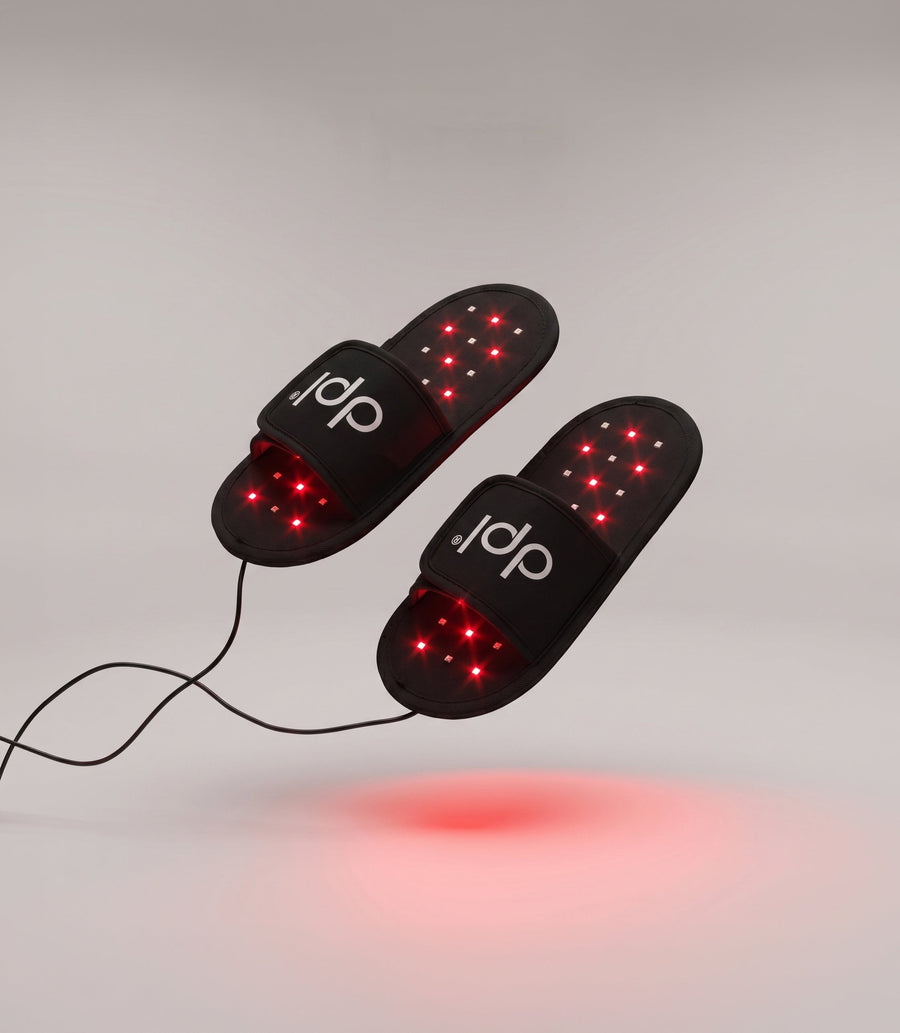 Pair of dpl light therapy slippers with illuminated inner surfaces and power cords